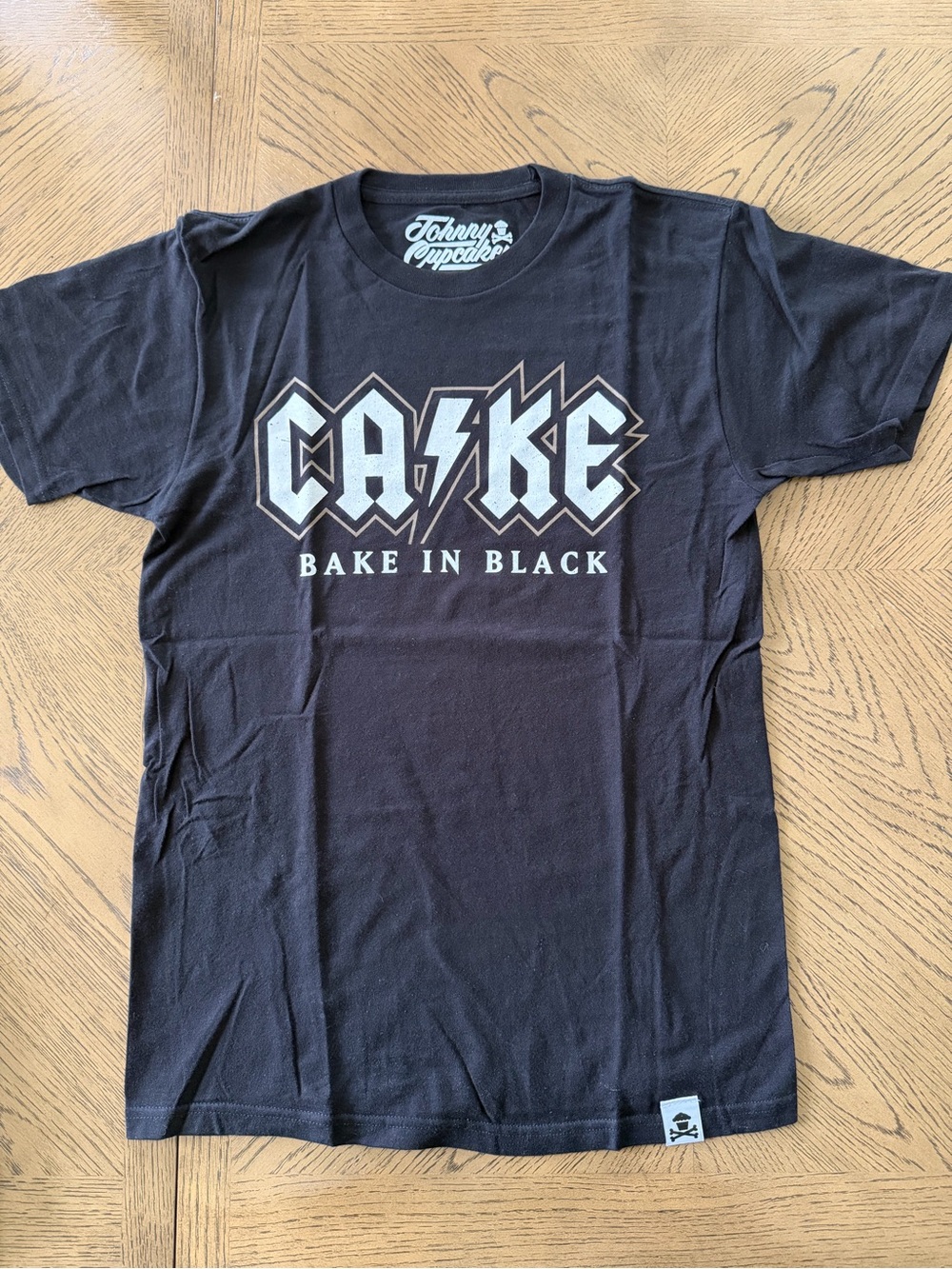 Men’s Johnny Cupcakes "CAKE - Bake in Black" Tee
